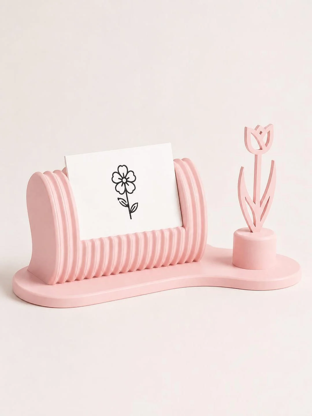 Floral business card holder in light pink with a business card displayed