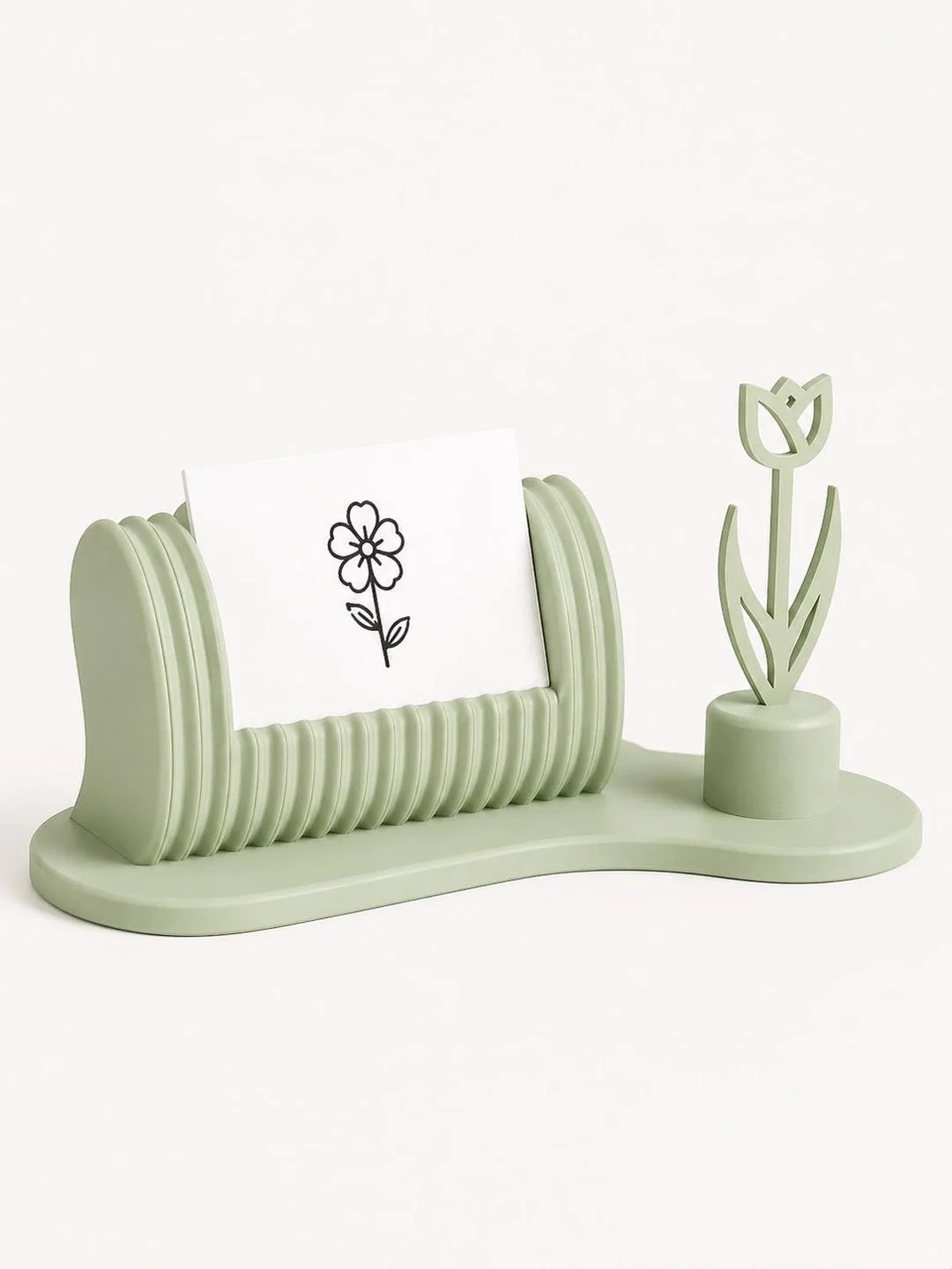 Floral business card holder in light green with a business card displayed